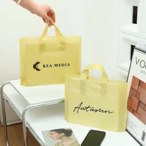Custom Brand Logo Durable Luxury PE Plastic Carrier Bags No MOQ Die Cut Handle Premium Apparel Retail Packaging Pouches