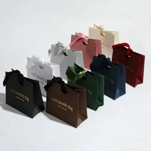 Custom Logo Blue Recycled Kraft Paper Jewelry Gift Storage Packaging Bag with High end Ribbon Handle Portable Luxury Design
