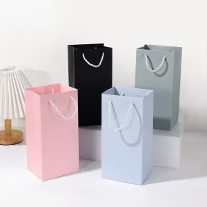 Custom Logo Solid Hard Paper Gift Bag Twisted Rope Handle Thermos Cup Cigarette Bag For Business Birthday Holiday Gift