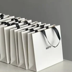 Custom White Paperboard Bags with Luxury Ribbon Handles for Christmas Gifts