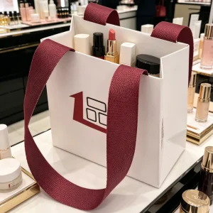 Eco Luxury Coated Paper Cosmetic Mini Shopping Bag Custom Logo Satin Ribbon Handle Gift Packaging Bag for Beauty Business