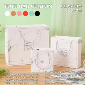 Eco Reusable Custom Gold Foil Ribbon White Cardboard Paper Bag for Garment Store Daily Customer Checkout Packaging