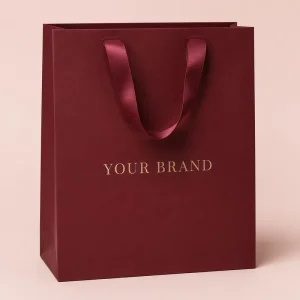 Luxury Burgundy Paper Gift Bag with Gold Foil Custom Logo and Satin Ribbon Handles for Jewelry Perfume Retail Packaging Bag