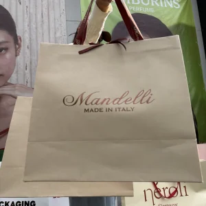 Luxury Matte Beige Shopping Bags with Printed Satin Ribbon Handles Oversized Bags for High End Apparel Wedding