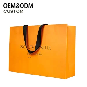 Luxury Orange Paper Shopping Bag with Ribbon Handle Embossed Gold Foil Logo Fully Customizable Eco Friendly Promotion Packaging