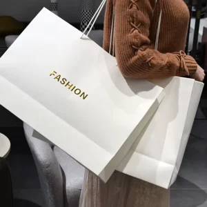 OEM Brand Logo Matte White Paper Shopping Bags Custom Design Ribbon for Fashion Boutiques Cosmetic Shops Promotional Events