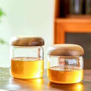 OEM High Borosilicate Round Glass Jars with Bamboo Lid Cap Collar for High Temperature Honey Storage