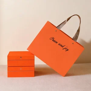 Orange Luxury Specialty Paper Bags Custom Logo Reusable Ribbon Handle 1pc MOQ for High end Fashion Supermarket Promotion