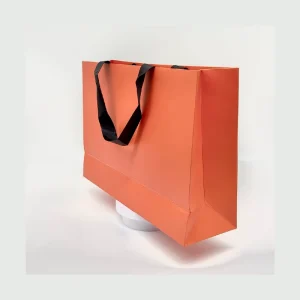 Vibrant Eco Friendly Durable Luxury Orange Matte Finish Paper Bag Black Handles Custom Logo Promotional Exhibition Retail